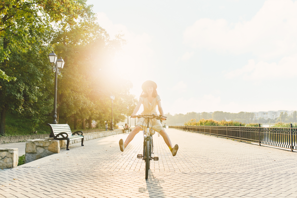 young woman with bike. klein